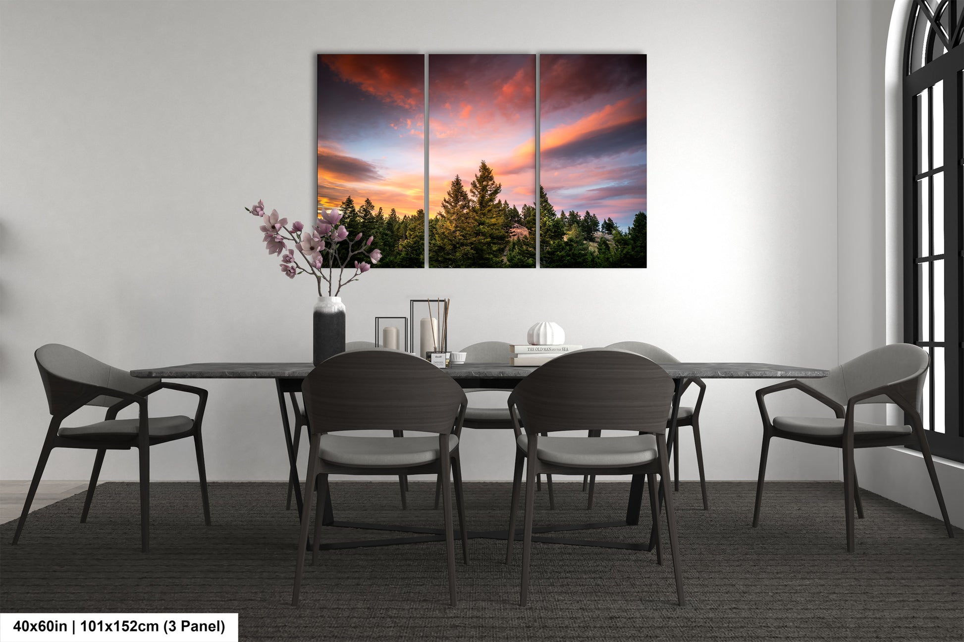 a dining room table with four chairs and a painting on the wall