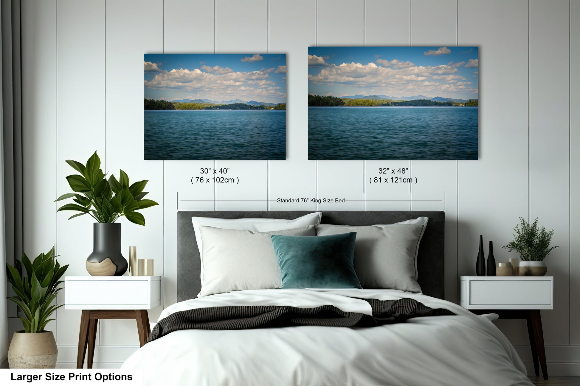 a bedroom with a large bed and two framed landscape photographs hanging on the wall above it.