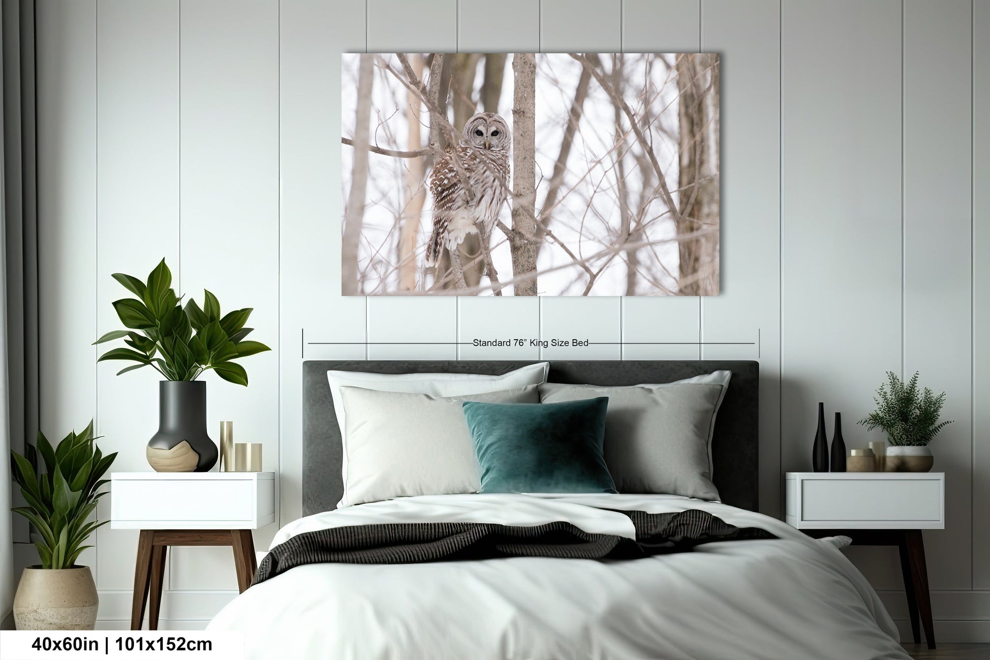 a bedroom with a bed and a painting on the wall