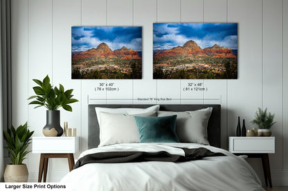 a bedroom with a bed and two pictures on the wall
