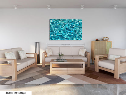 a modern living room with a large, vibrant blue watercolor painting hanging on the wall above a wooden coffee table. The room is furnished with a sofa, two armchairs, and a wooden cabinet. The overall design and color scheme create a serene and inviting atmosphere.