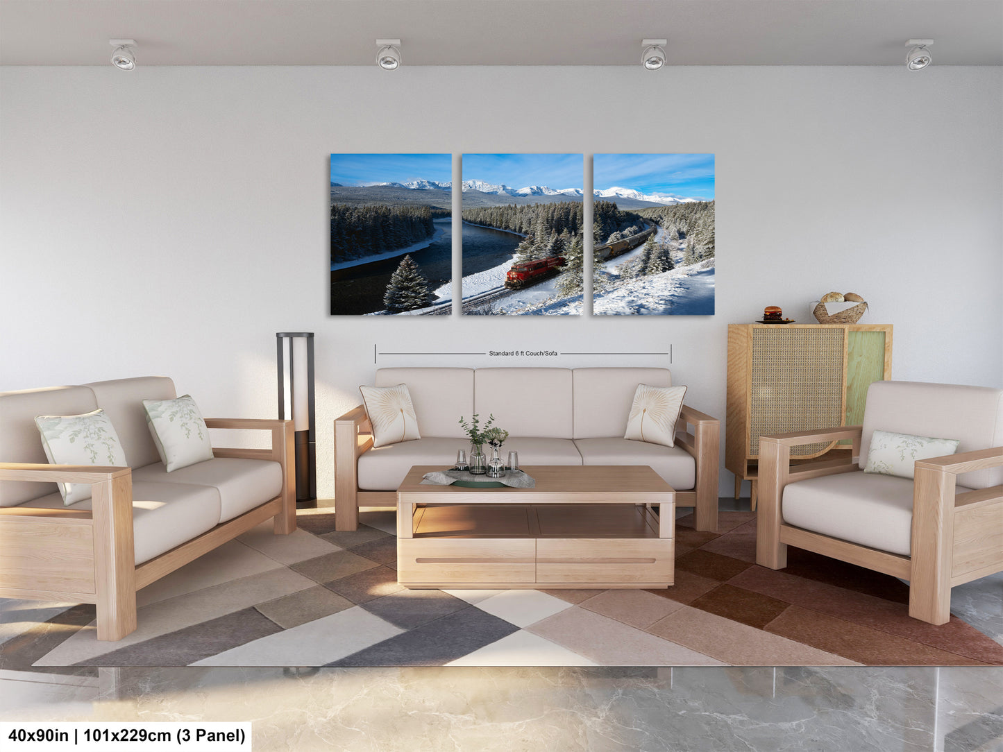 The image is a modern living room with a large, three-panel landscape painting hanging on the wall. The painting depicts a snowy mountain landscape with a train passing through the scene. The room is furnished with a sofa, two chairs, and a coffee table, creating a cozy and inviting atmosphere.