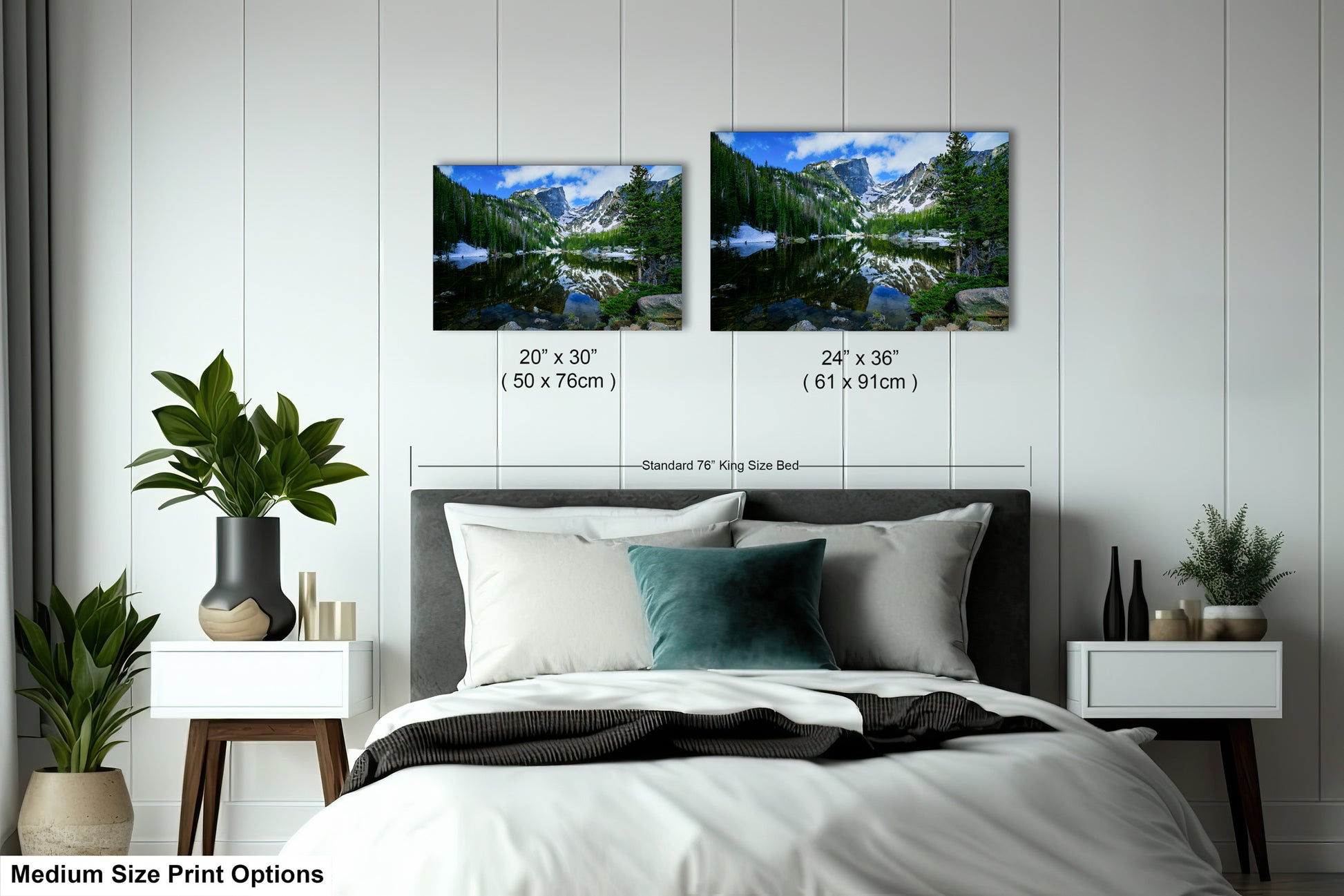 a bedroom with a bed and two pictures on the wall