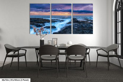 a dining room with a table and chairs