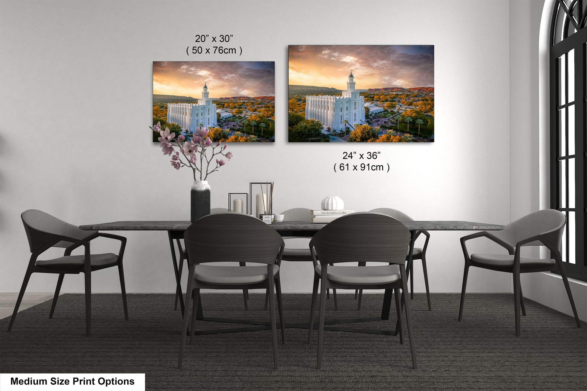 a dining table with four chairs and a vase of flowers
