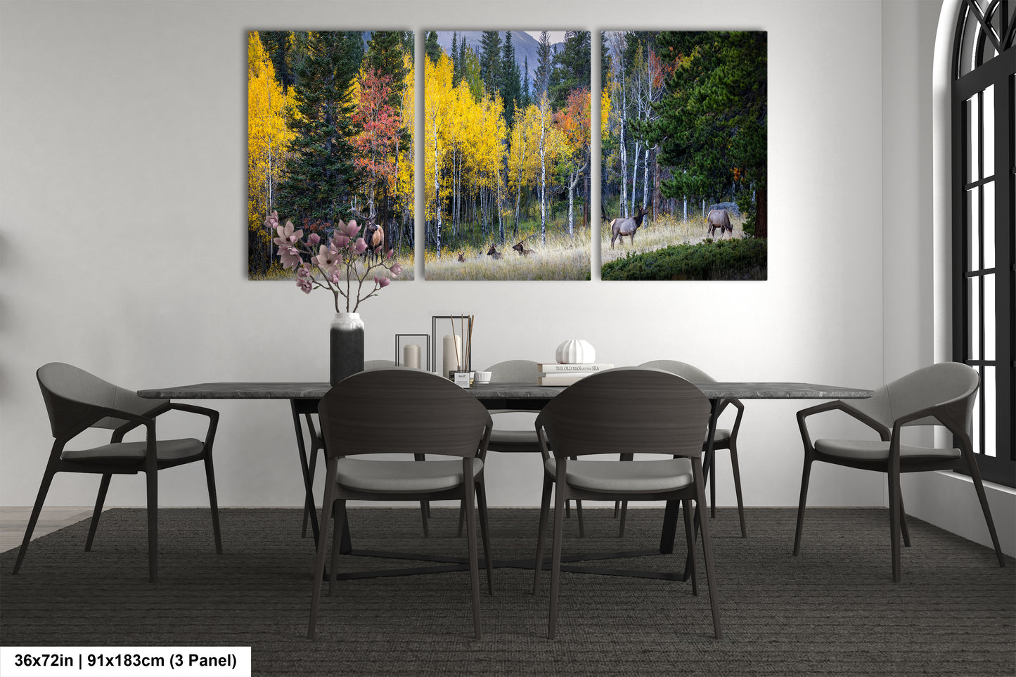 a dining room table with chairs and a painting on the wall