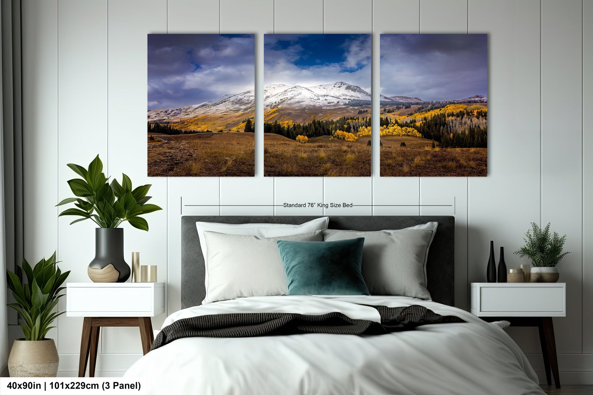 a bed room with a neatly made bed and two pictures on the wall