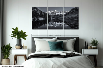 a black and white photo of a bedroom