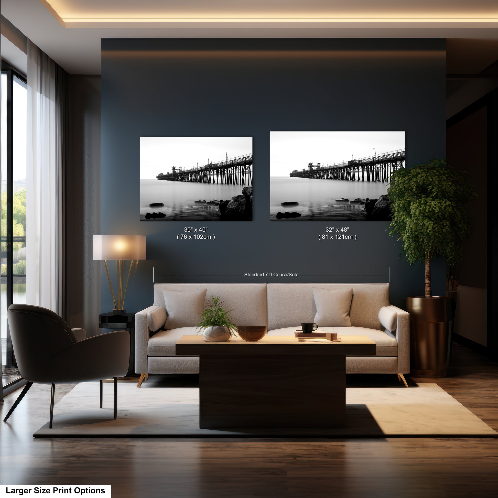 a living room with a couch and two pictures on the wall