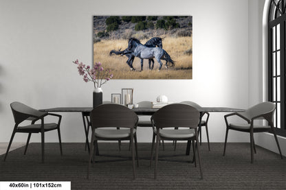 a painting of two horses running across a field