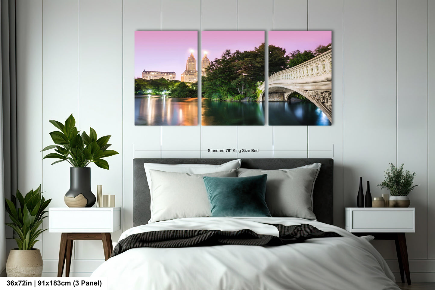 a bedroom with a bed and two paintings on the wall