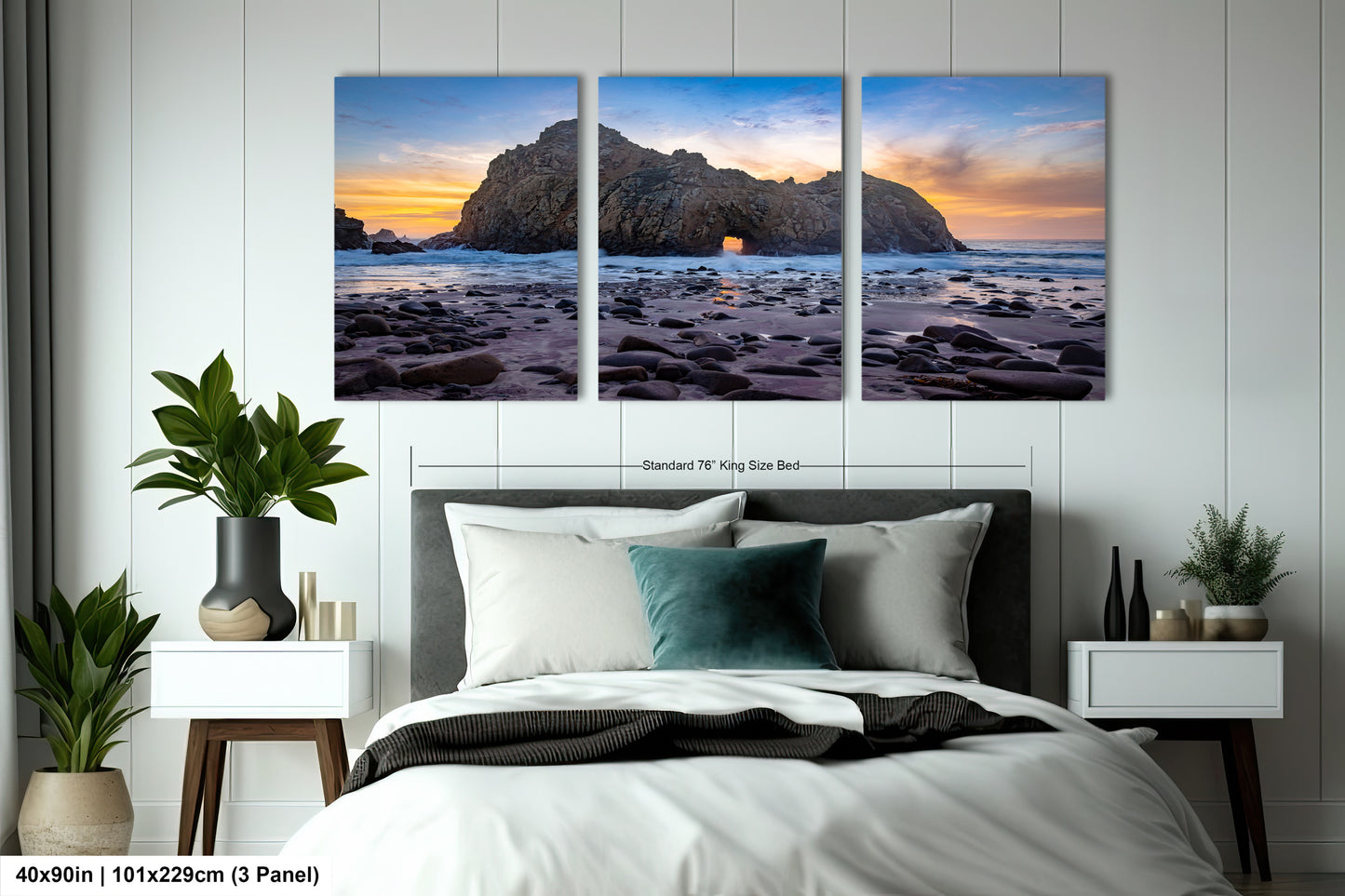 a bedroom with a bed and two paintings on the wall
