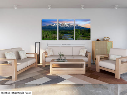 a living room filled with furniture and a painting on the wall