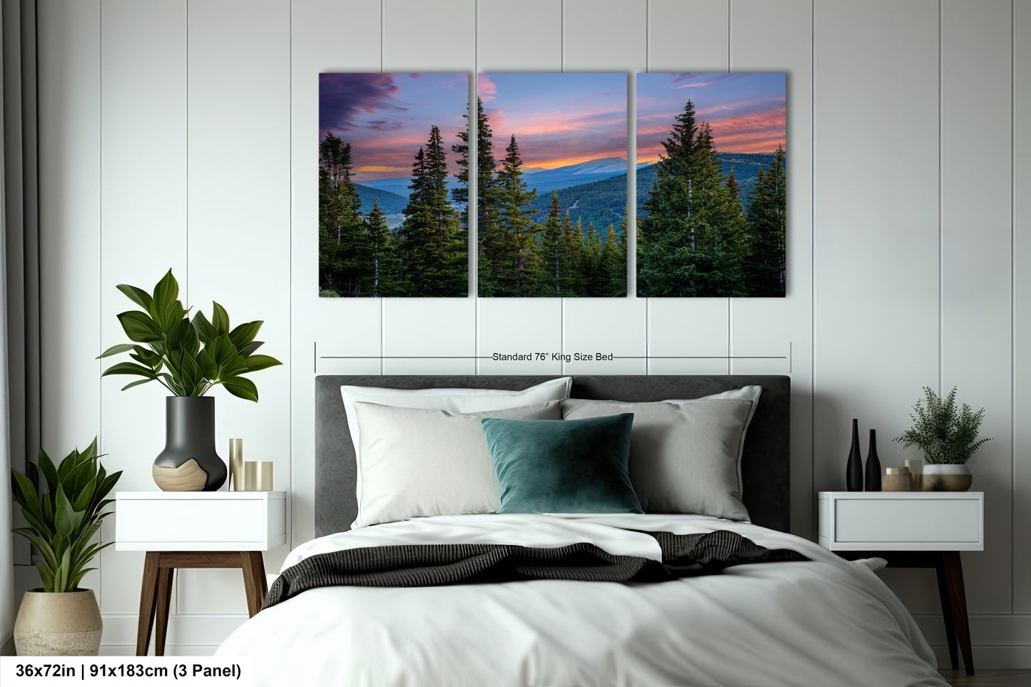 A bedroom with a large bed, nightstands, and a large wall art depicting a scenic mountain landscape with pine trees and a colorful sunset.