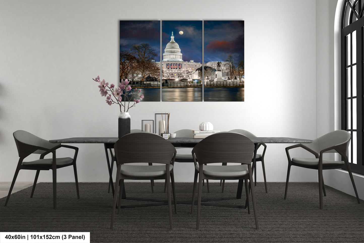 a dining room table with chairs and a picture of the capitol building