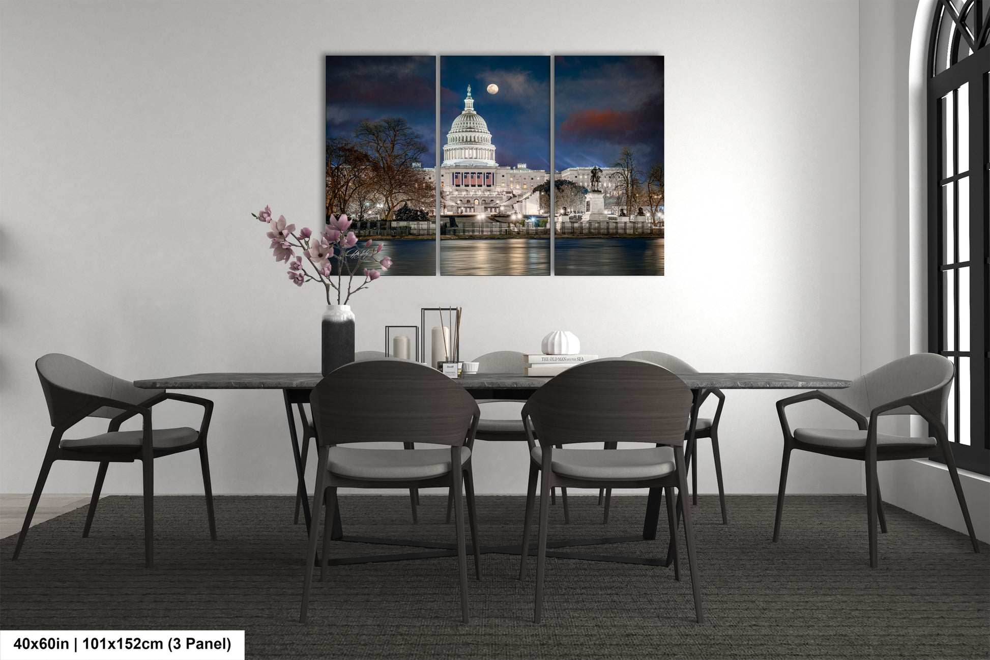 a dining room table with chairs and a picture of the capitol building