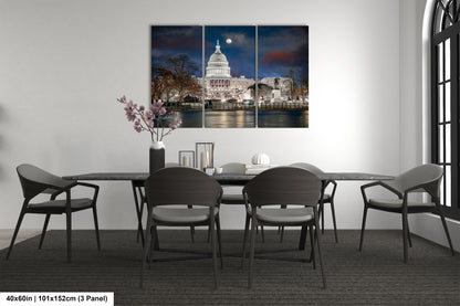 a dining room table with chairs and a picture of the capitol building