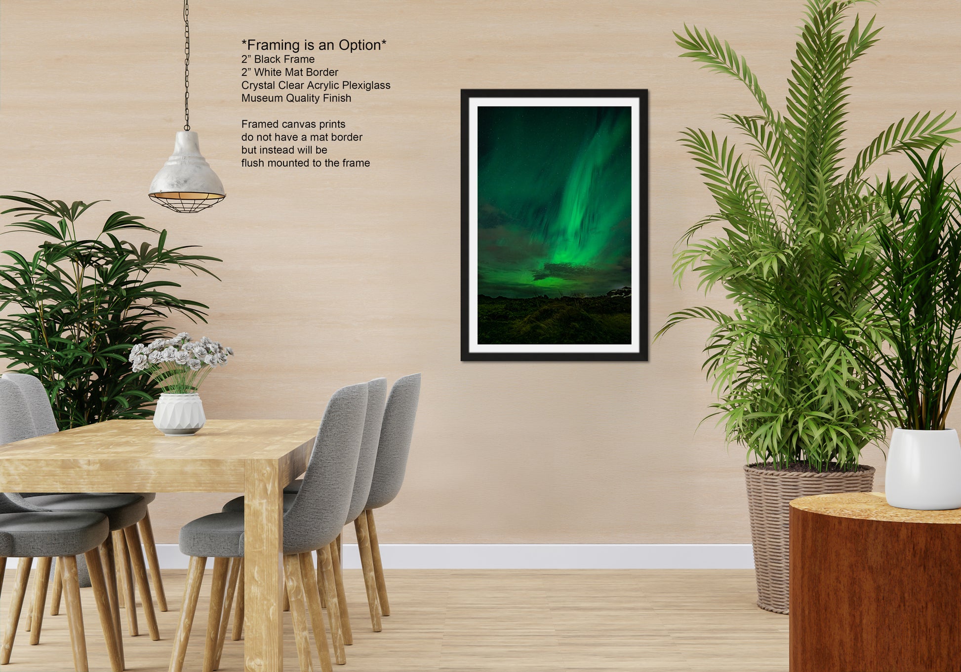 a modern dining room with a wooden table and chairs, a framed picture of the Aurora Borealis, and several potted plants.