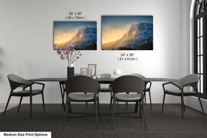 a dining table with four chairs and a vase of flowers
