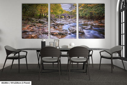 a dining room table with chairs and a painting on the wall
