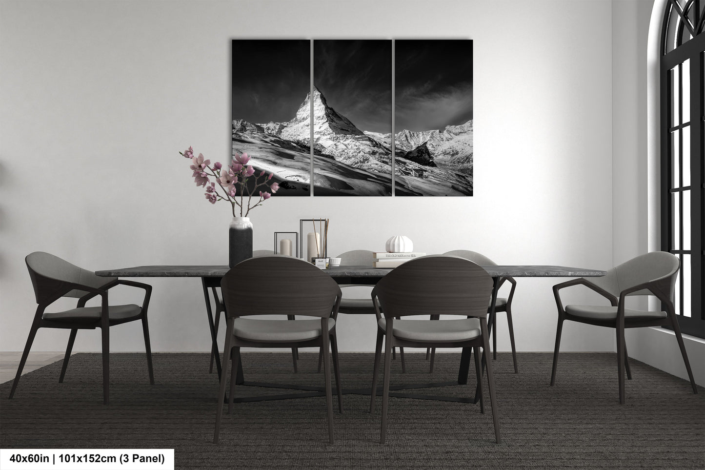 a black and white photo of a dining room table
