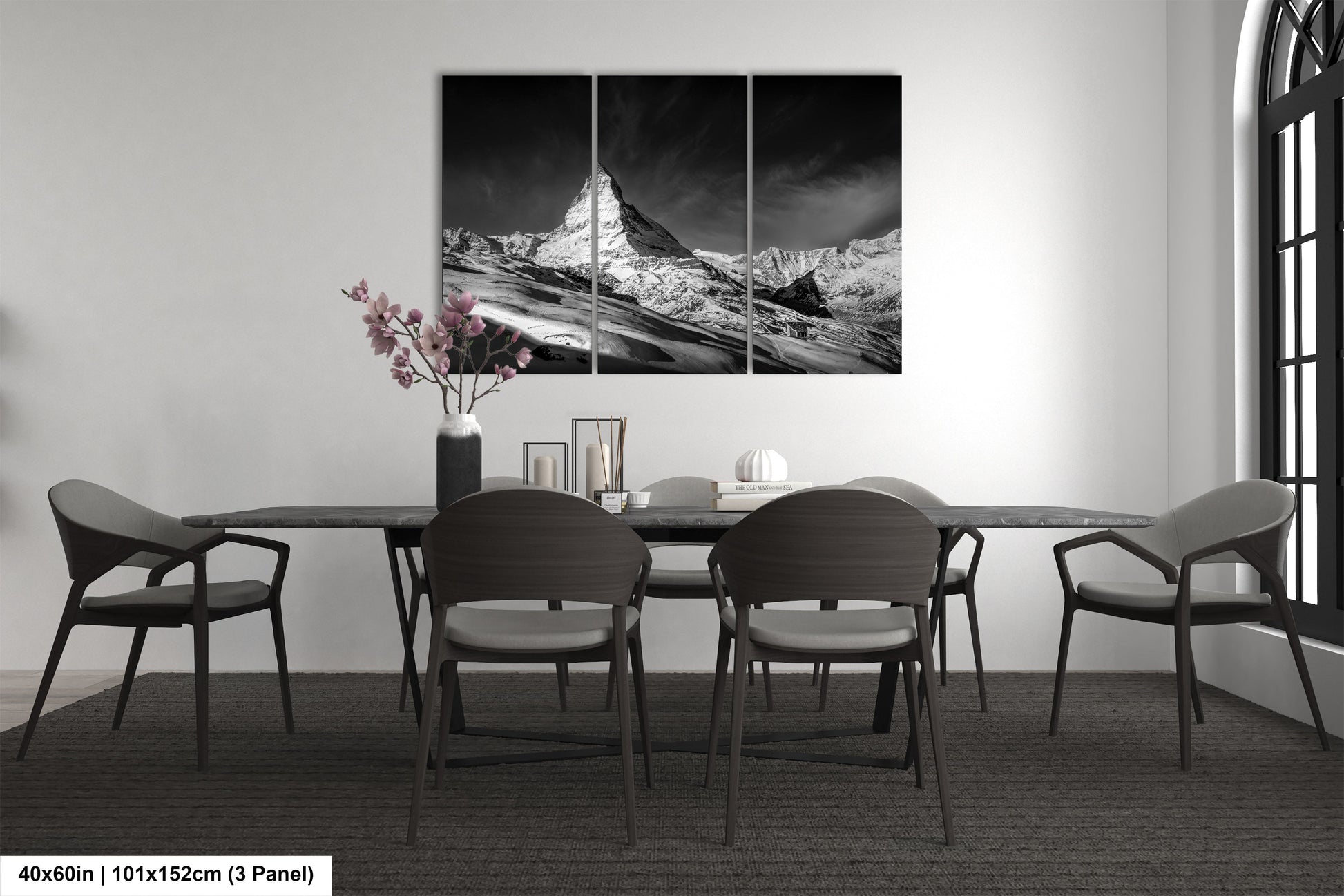 a black and white photo of a dining room table
