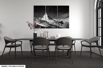 a black and white photo of a dining room table