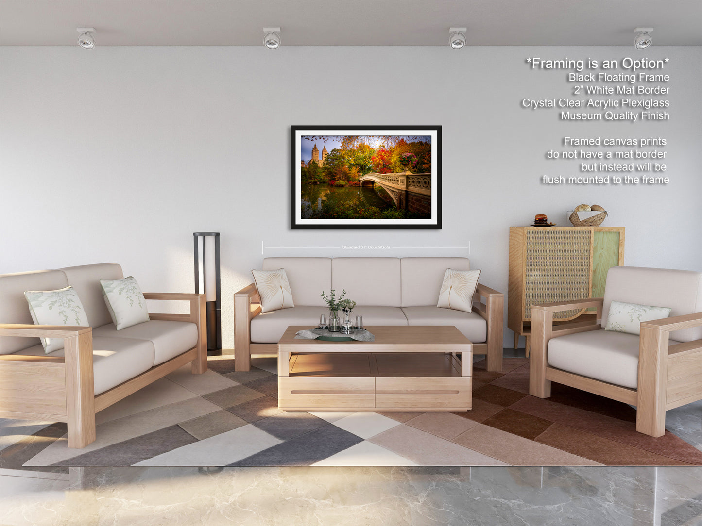 a modern living room with a large window, a gray sofa, a wooden coffee table, and a framed landscape painting hanging on the wall.