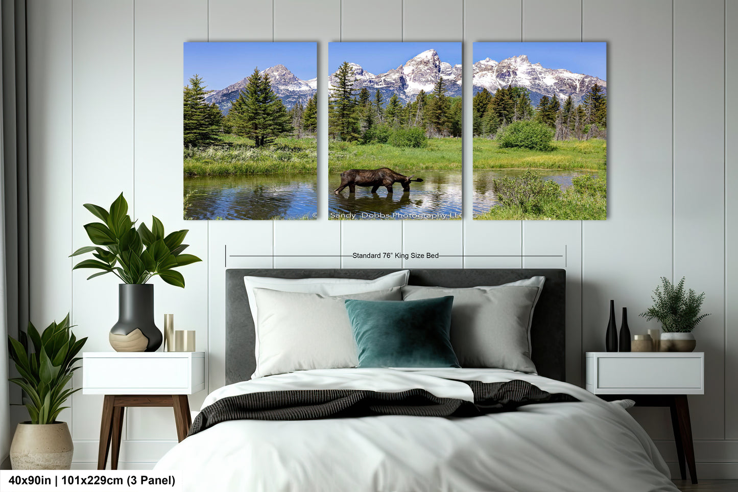 a bed room with a neatly made bed and two paintings on the wall