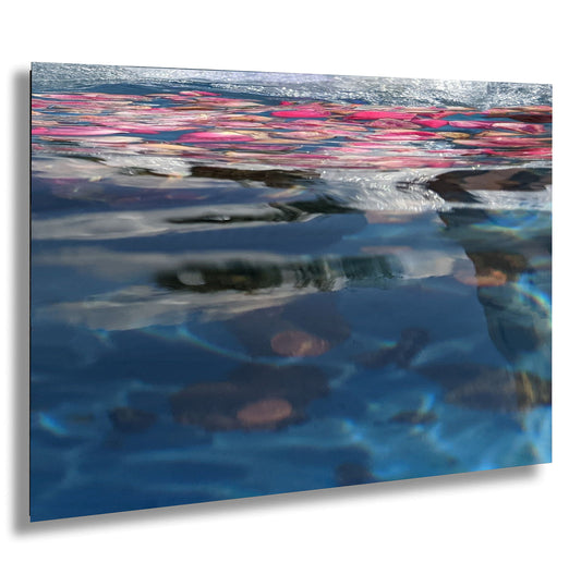 a picture of a pool with water reflecting the sky