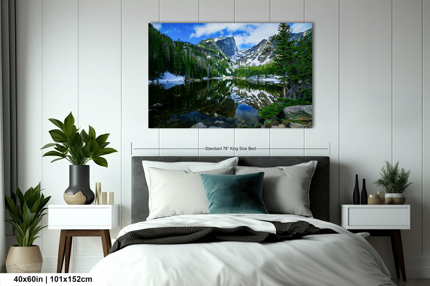 a bedroom with a bed and a painting on the wall