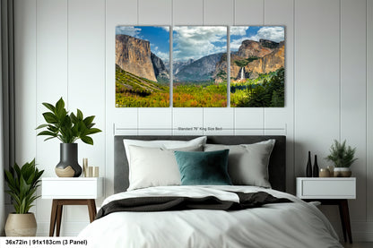 a bed room with a neatly made bed and two pictures on the wall