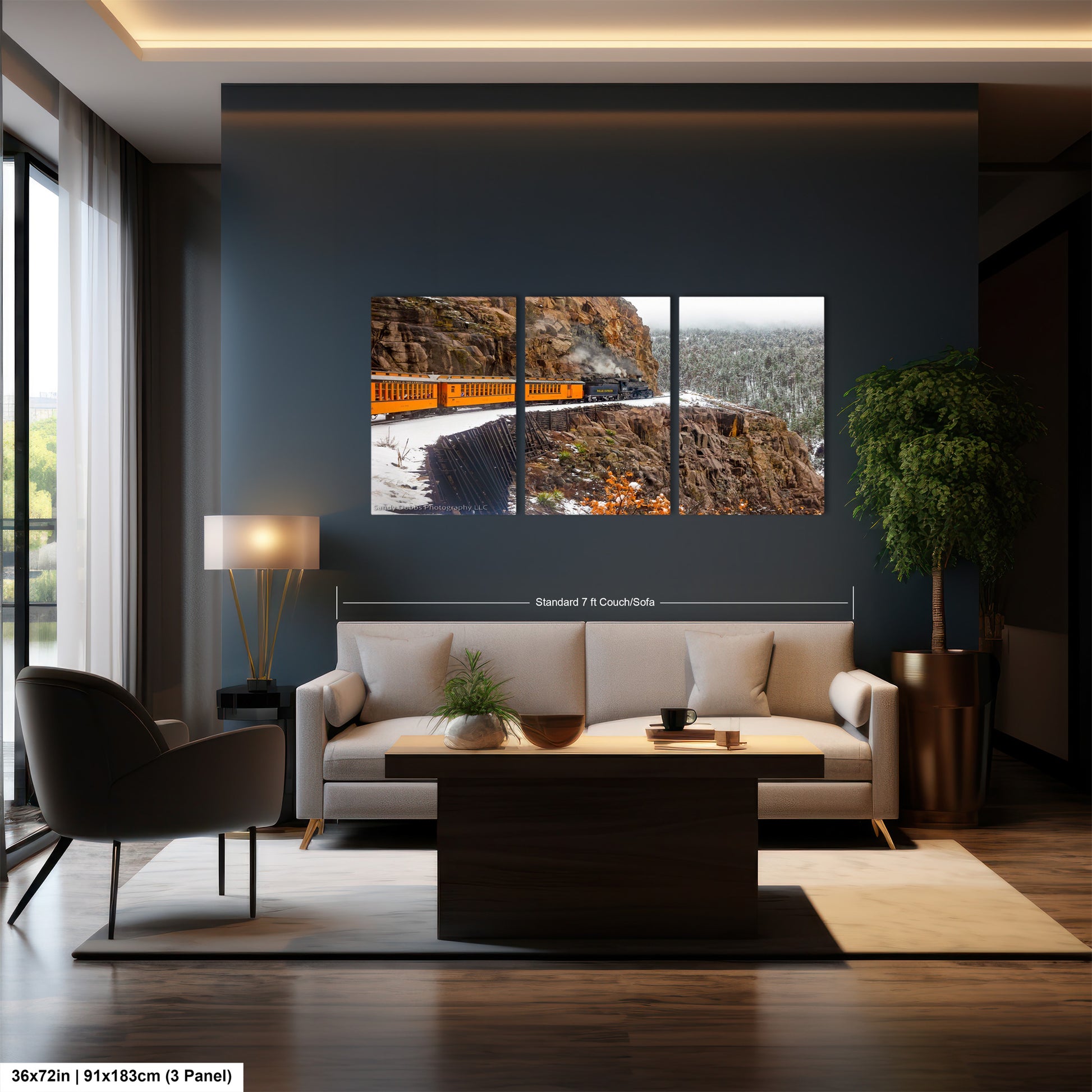 a living room with a couch a table and a painting on the wall