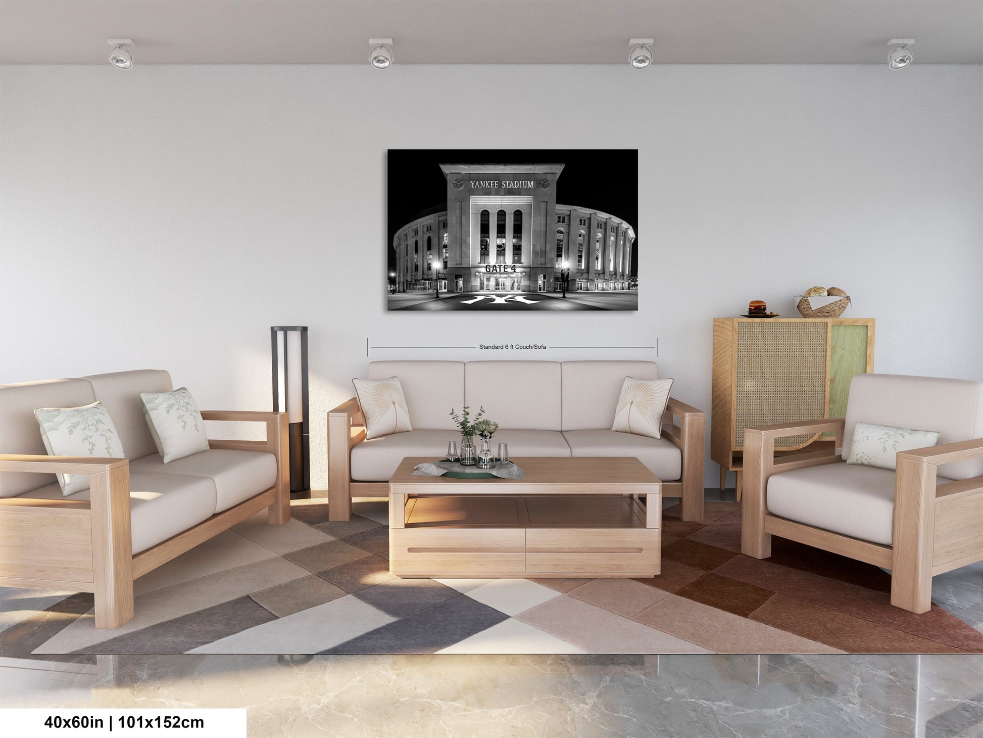 a modern living room with a large black and white photograph of a stadium or arena hanging on the wall. The room is furnished with a sofa, two chairs, and a coffee table, creating a comfortable and stylish seating area.