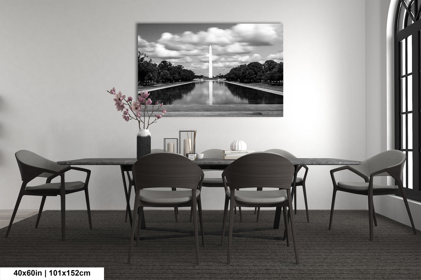 a black and white photo of a table and chairs