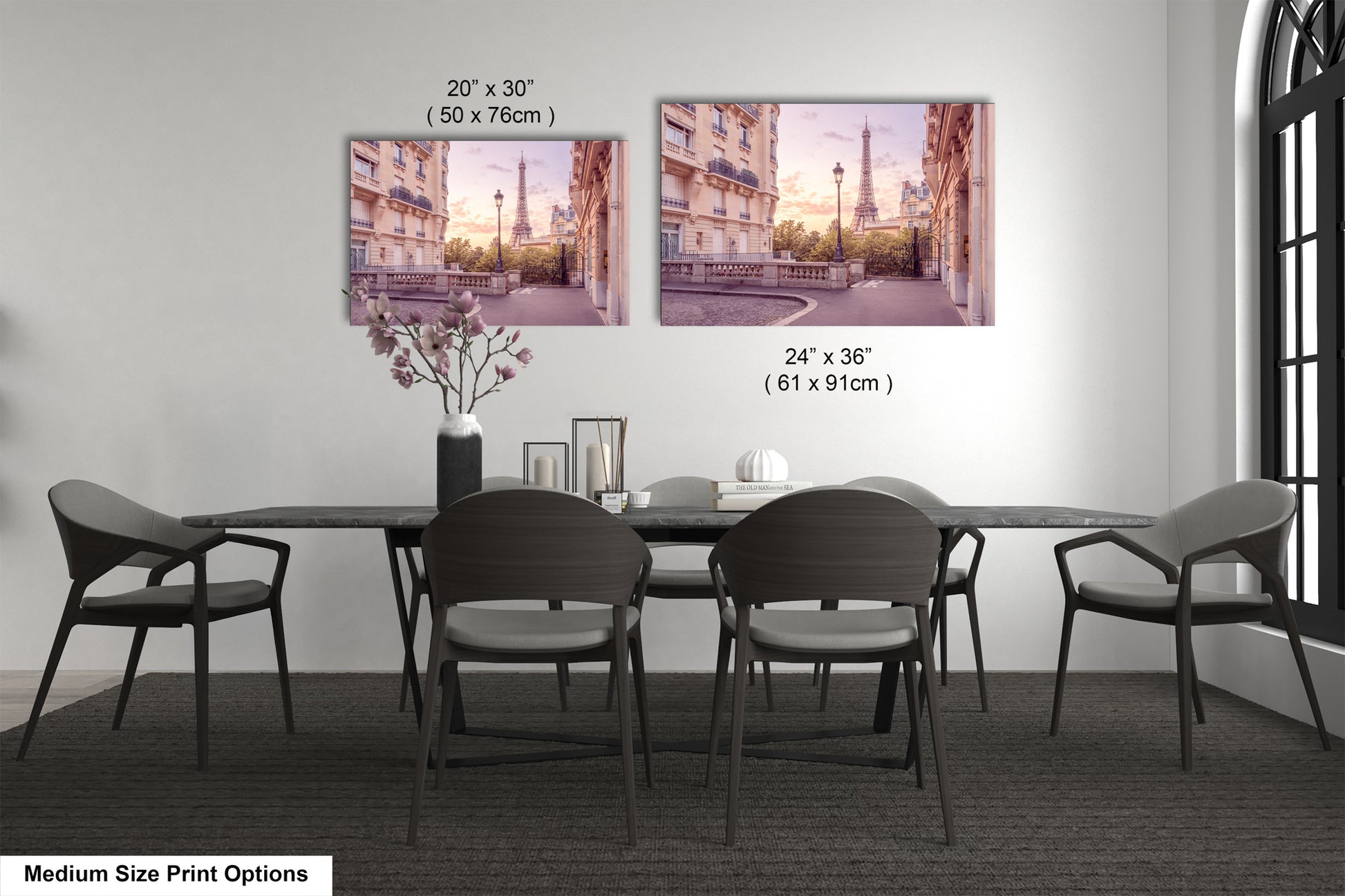 a dining room table with chairs and a vase of flowers