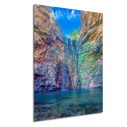 a picture of a waterfall in a canyon