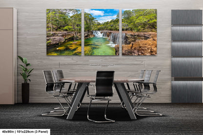 a dining room table with chairs and a painting on the wall