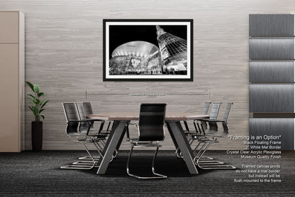 a black and white photo of a dining room table