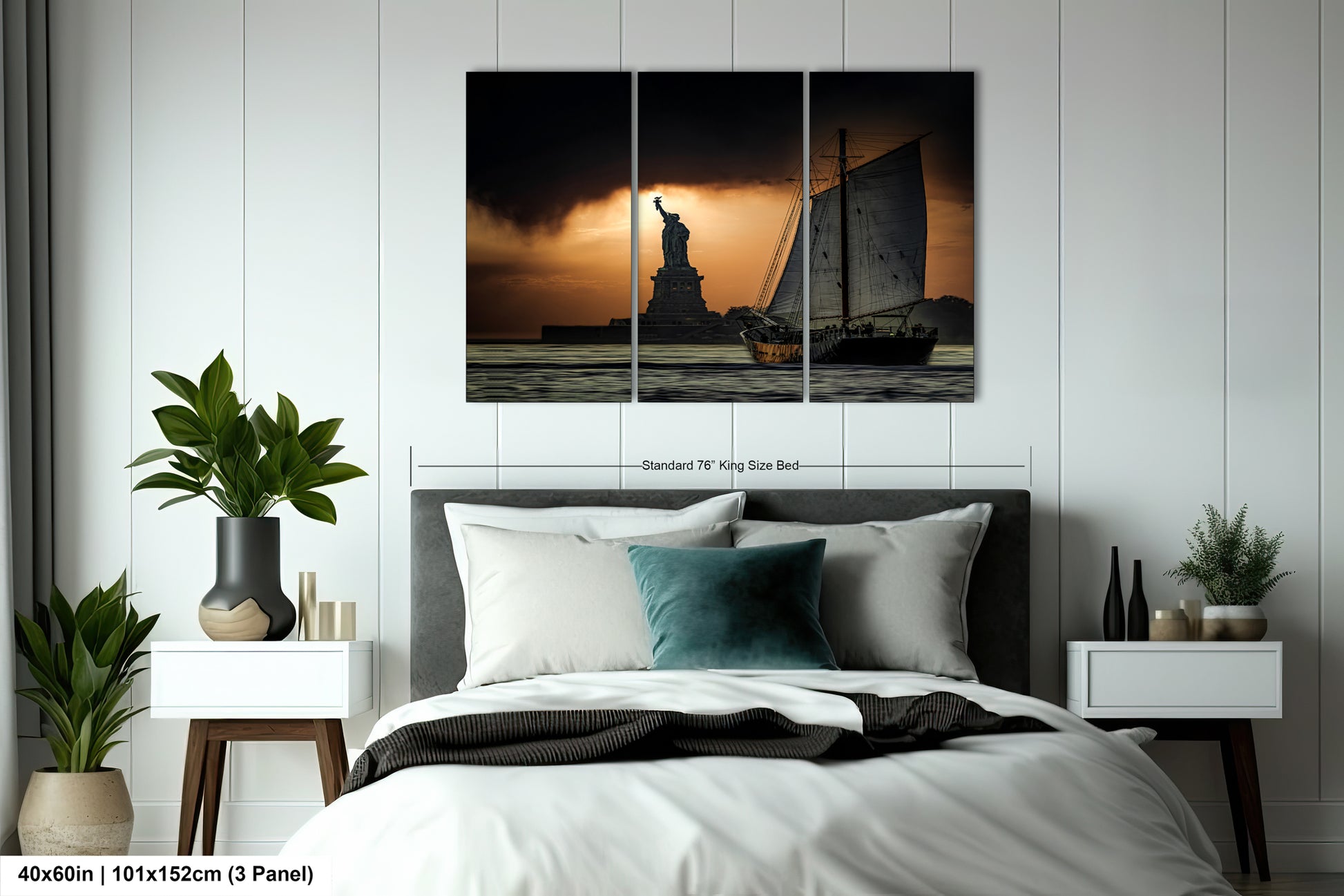 a bed room with a neatly made bed and a statue of liberty