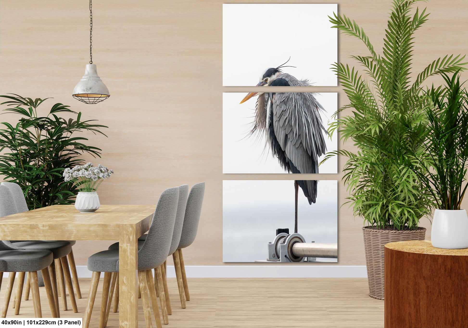 a room with a table, chairs, plants and a picture of a bird