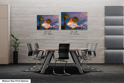 a dining room table with chairs and a sign on the wall