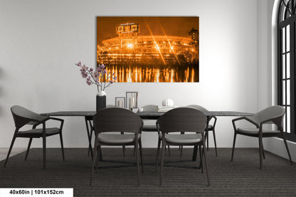 a dining room table with chairs and a painting on the wall