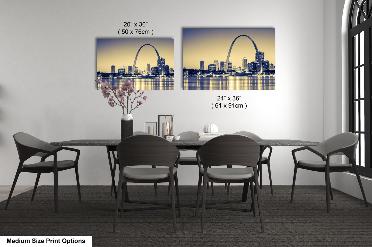 a dining room table with four chairs and a vase of flowers