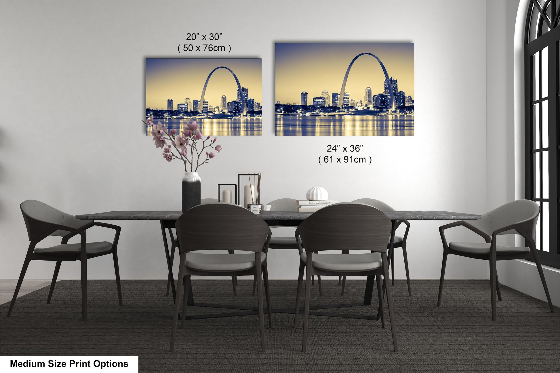 a dining room table with four chairs and a vase of flowers