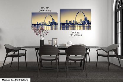 a dining room table with four chairs and a vase of flowers