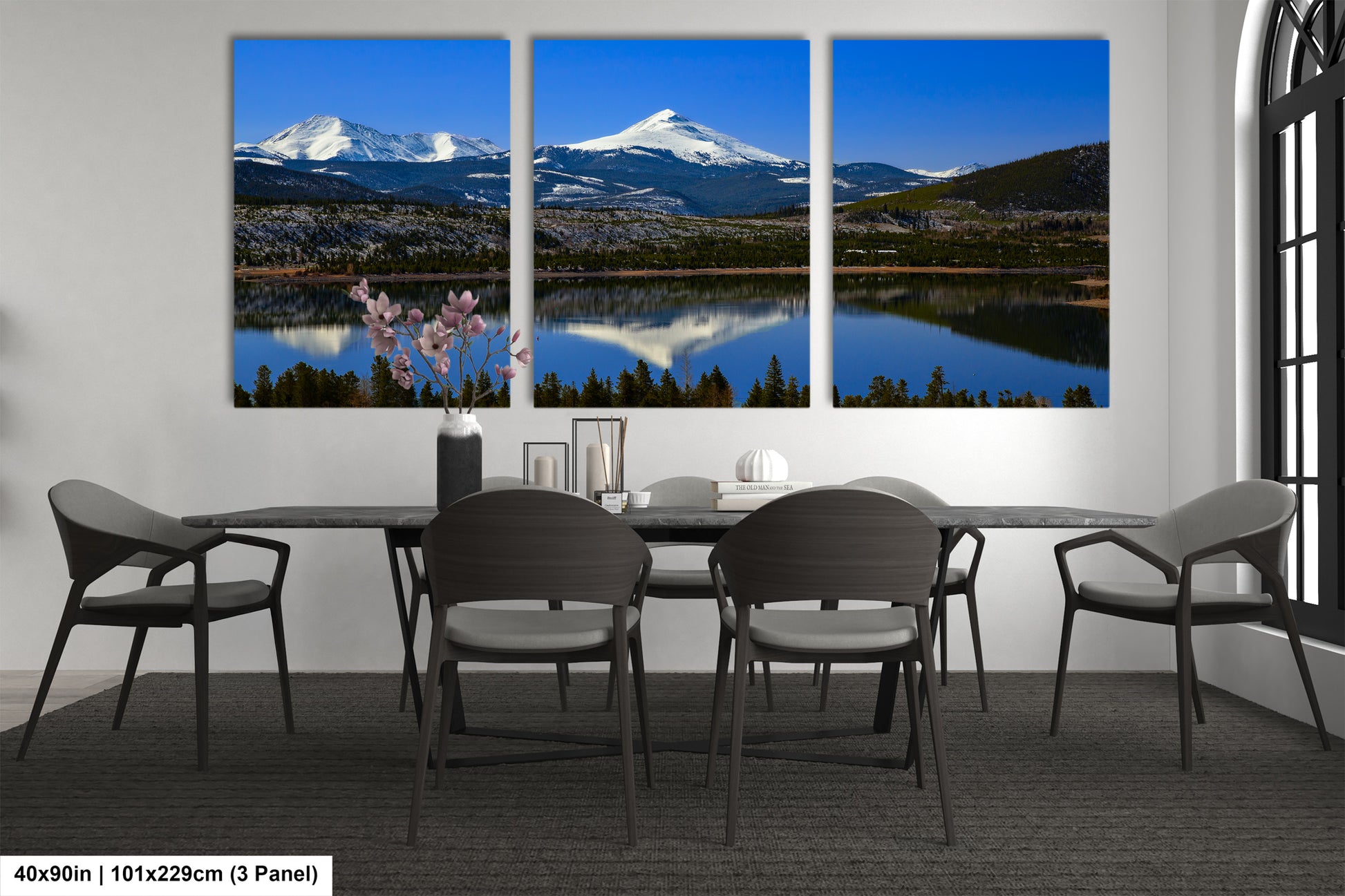 a dining room with a table and four chairs