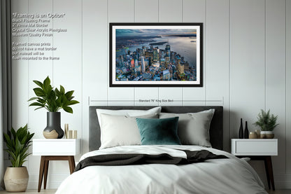 a bedroom with a picture of a city on the wall