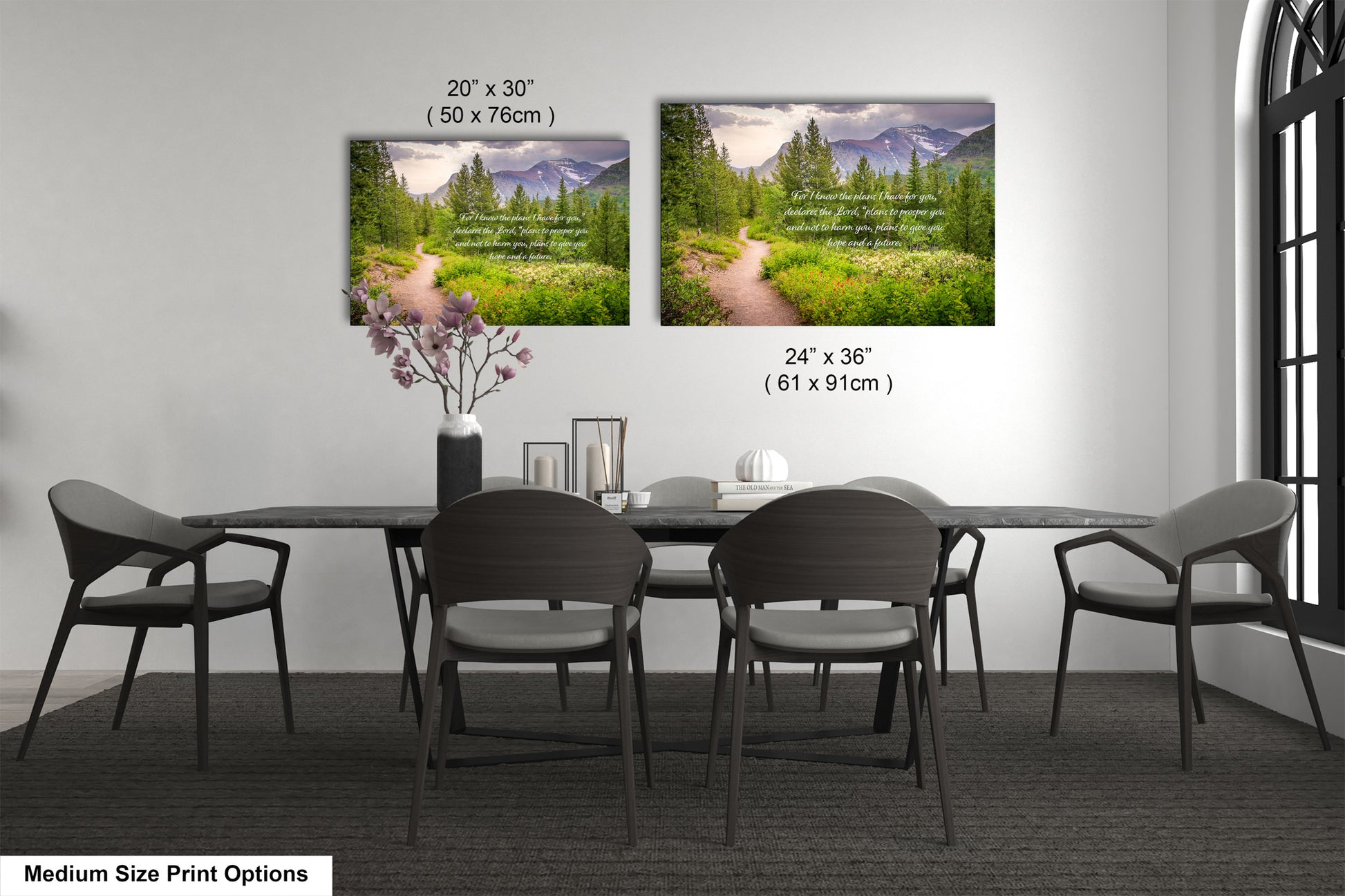 a dining room table with four chairs and a vase of flowers