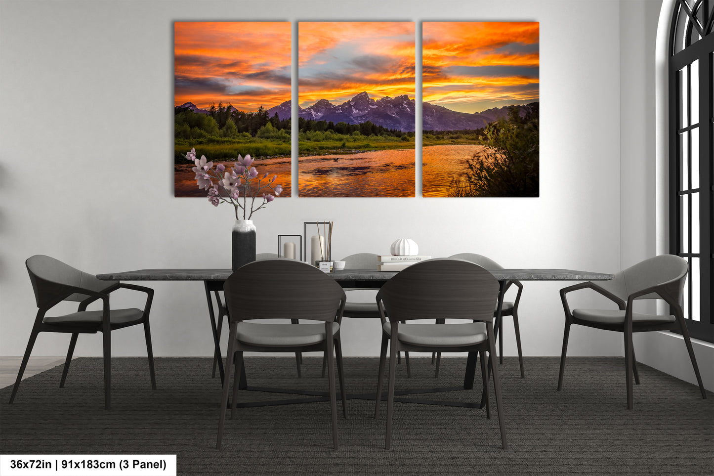 a dining room table with chairs and a painting on the wall